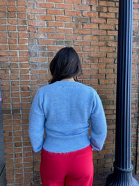 blue cardigan w multi colored buttons
