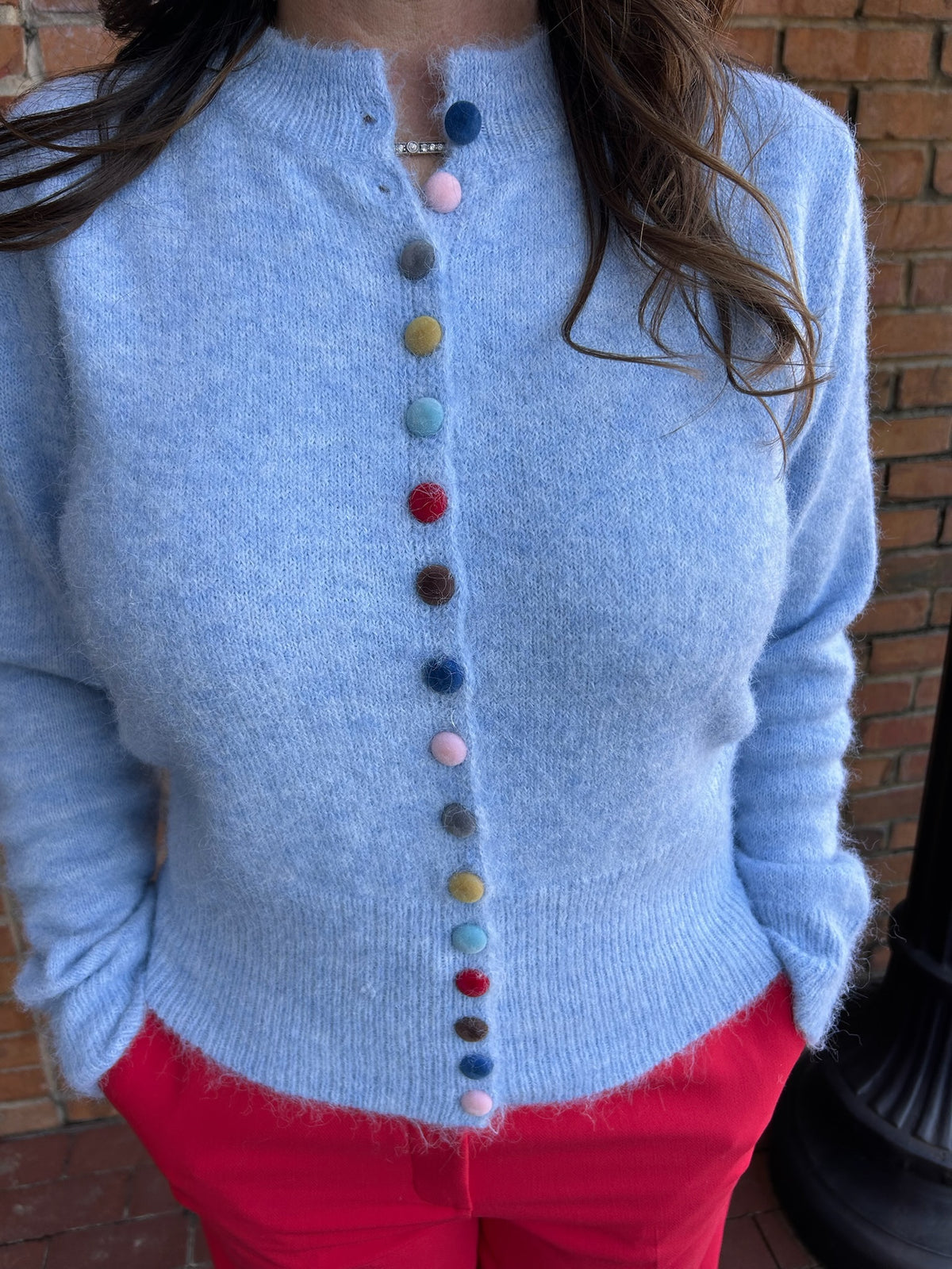 blue cardigan w multi colored buttons
