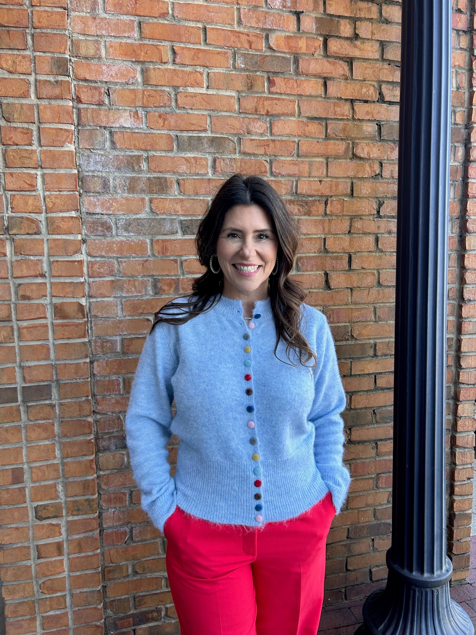blue cardigan w multi colored buttons